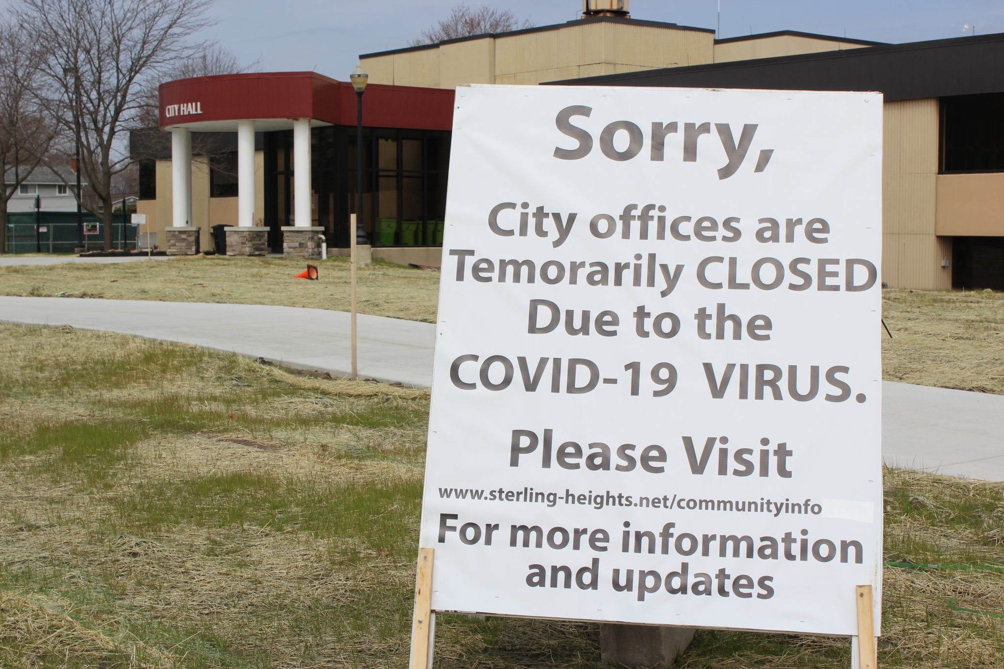 A sign outside of Sterling Heights city coucil saying offiices are temporarily closed because of the COVID-19 pandemic