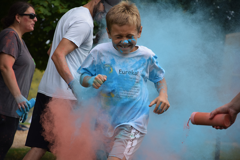 Travis Kimball's clothes get colored blue during the Oct. 4 Color Run at Ottawa Elementary School in Petoskey.