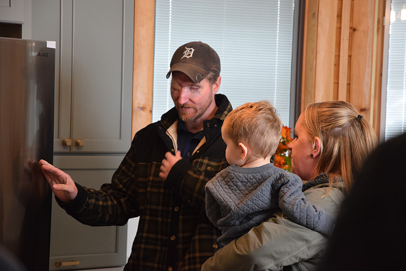 Retired U.S. Army Major Jonathan Turnbull walks around his freshly remodeled smart home on Nov. 2, 2023. His house was remodeled by the Tunnels to Towers Foundation.